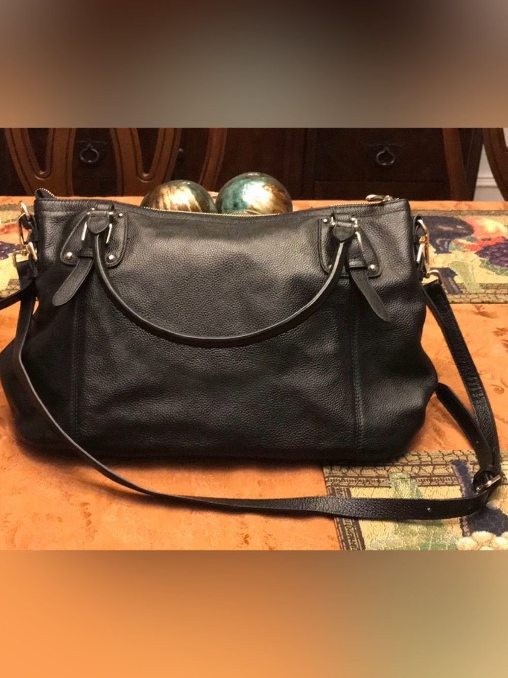 Large black leather handbag.